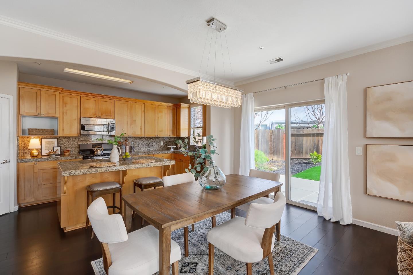 8850 Morey Way Gilroy, CA 95020 - Photo 8 of 34 a view of a dining room with furniture window and wooden floor