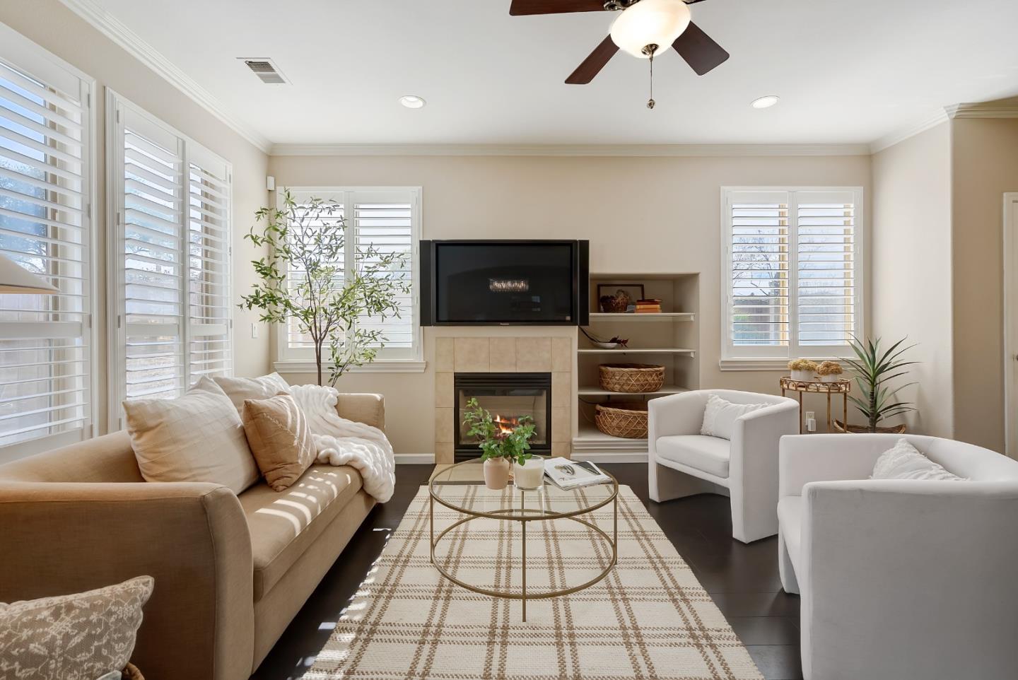 8850 Morey Way Gilroy, CA 95020 - Photo 9 of 34 a living room with furniture a flat screen tv and a fireplace