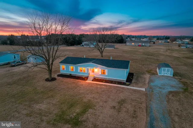 a view of a street with a building in the background