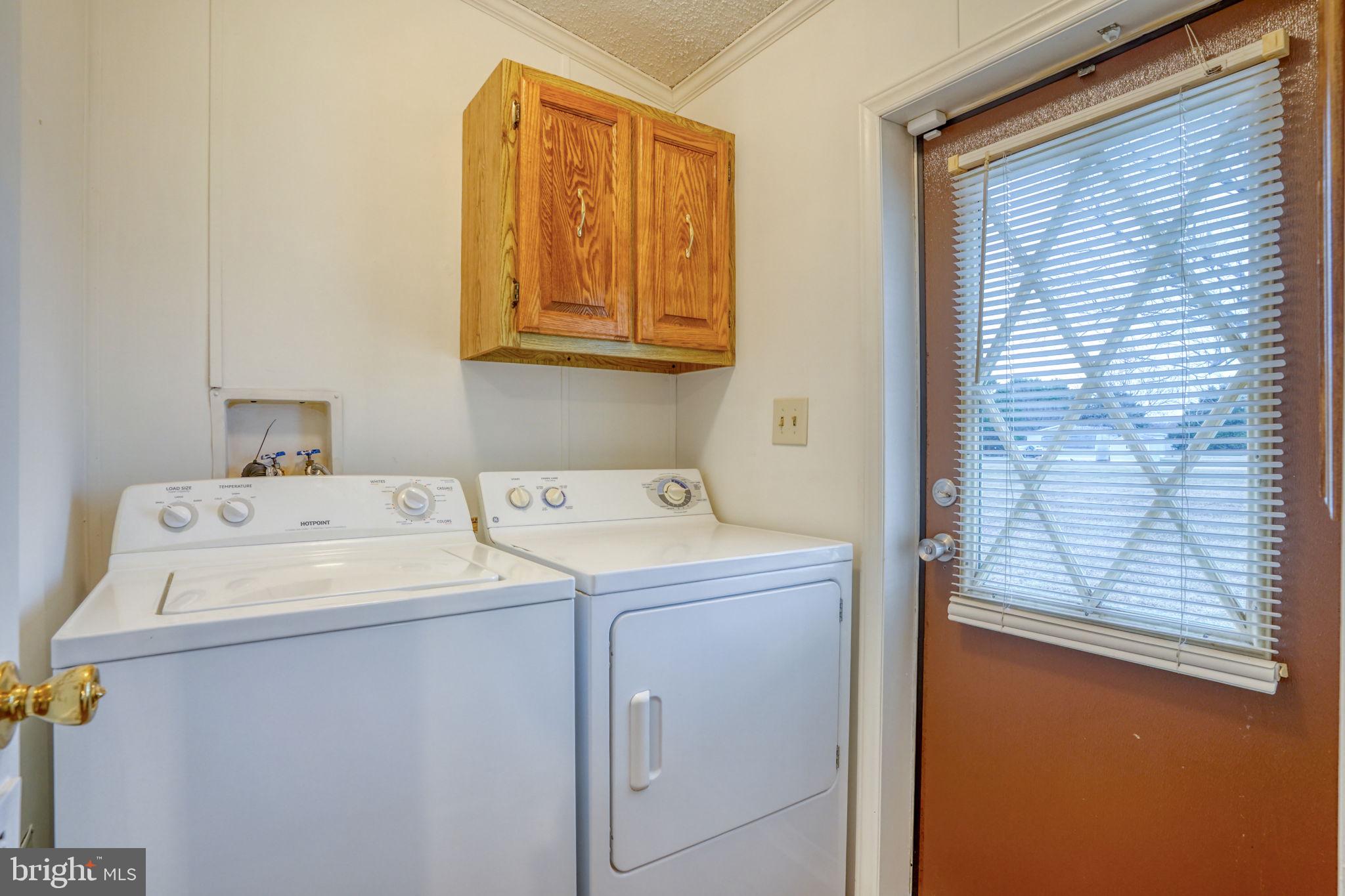 4285 Carpenter Bridge Road Felton, DE 19943 - Photo 23 of 45 a utility room with dryer and washer
