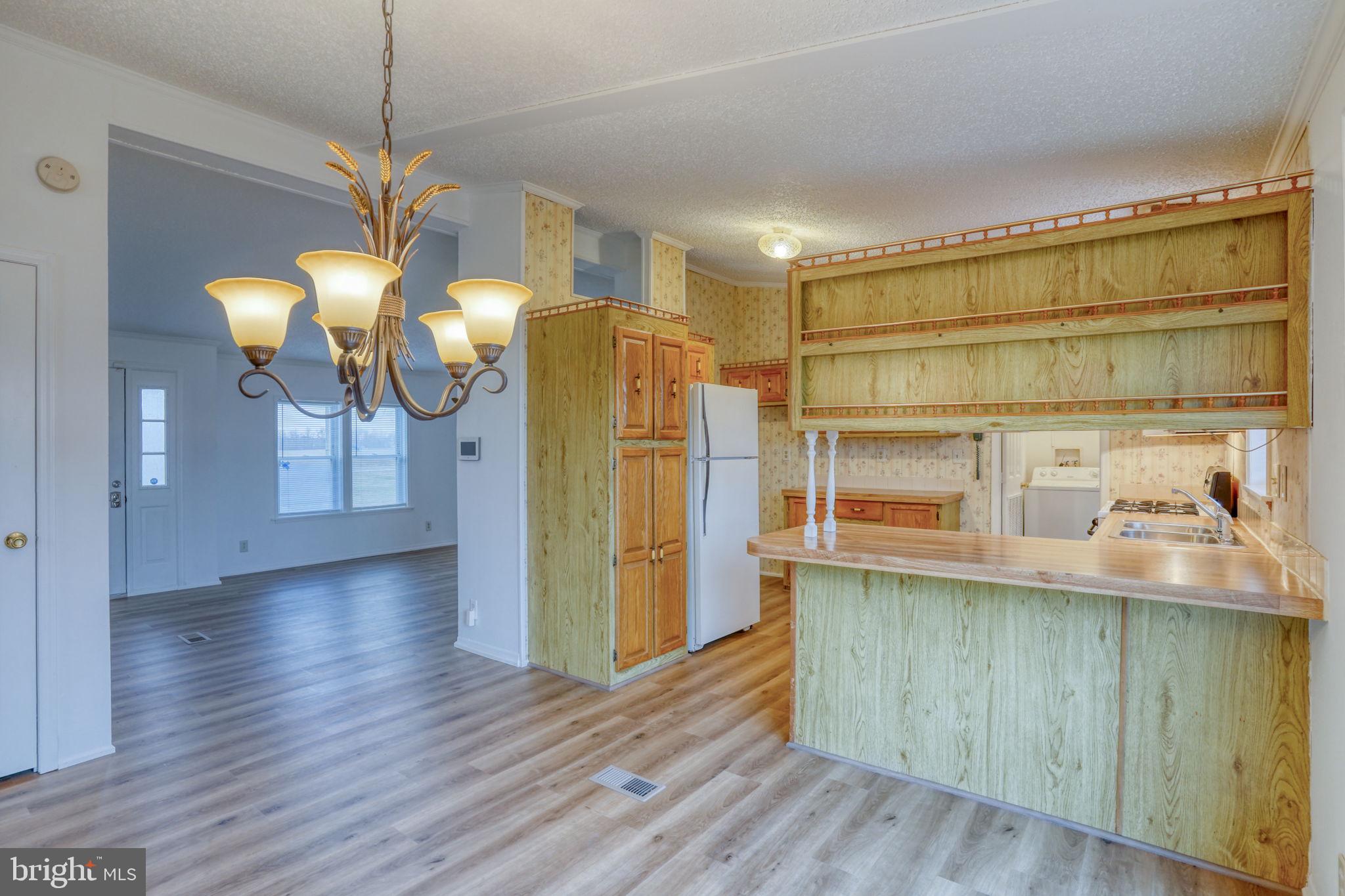 4285 Carpenter Bridge Road Felton, DE 19943 - Photo 27 of 45 a kitchen with stainless steel appliances granite countertop a refrigerator a oven a sink and dishwasher