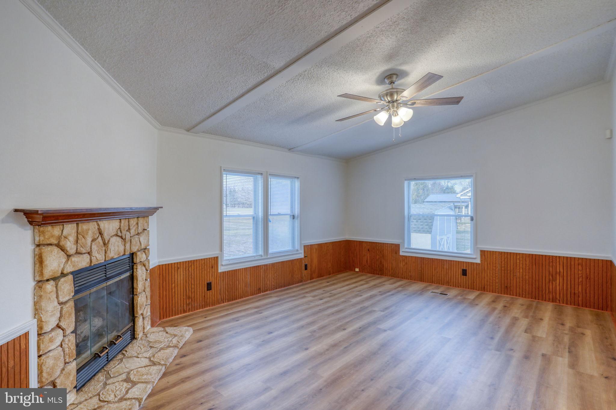 4285 Carpenter Bridge Road Felton, DE 19943 - Photo 29 of 45 a view of empty room with wooden floor and fan
