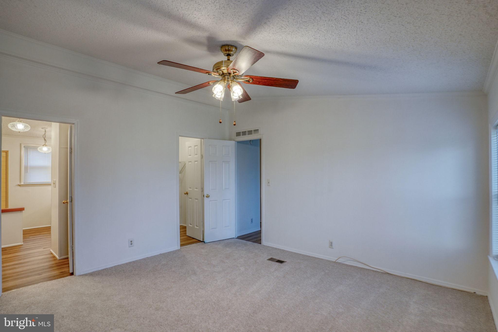 4285 Carpenter Bridge Road Felton, DE 19943 - Photo 35 of 45 an empty room with a fan and a fan