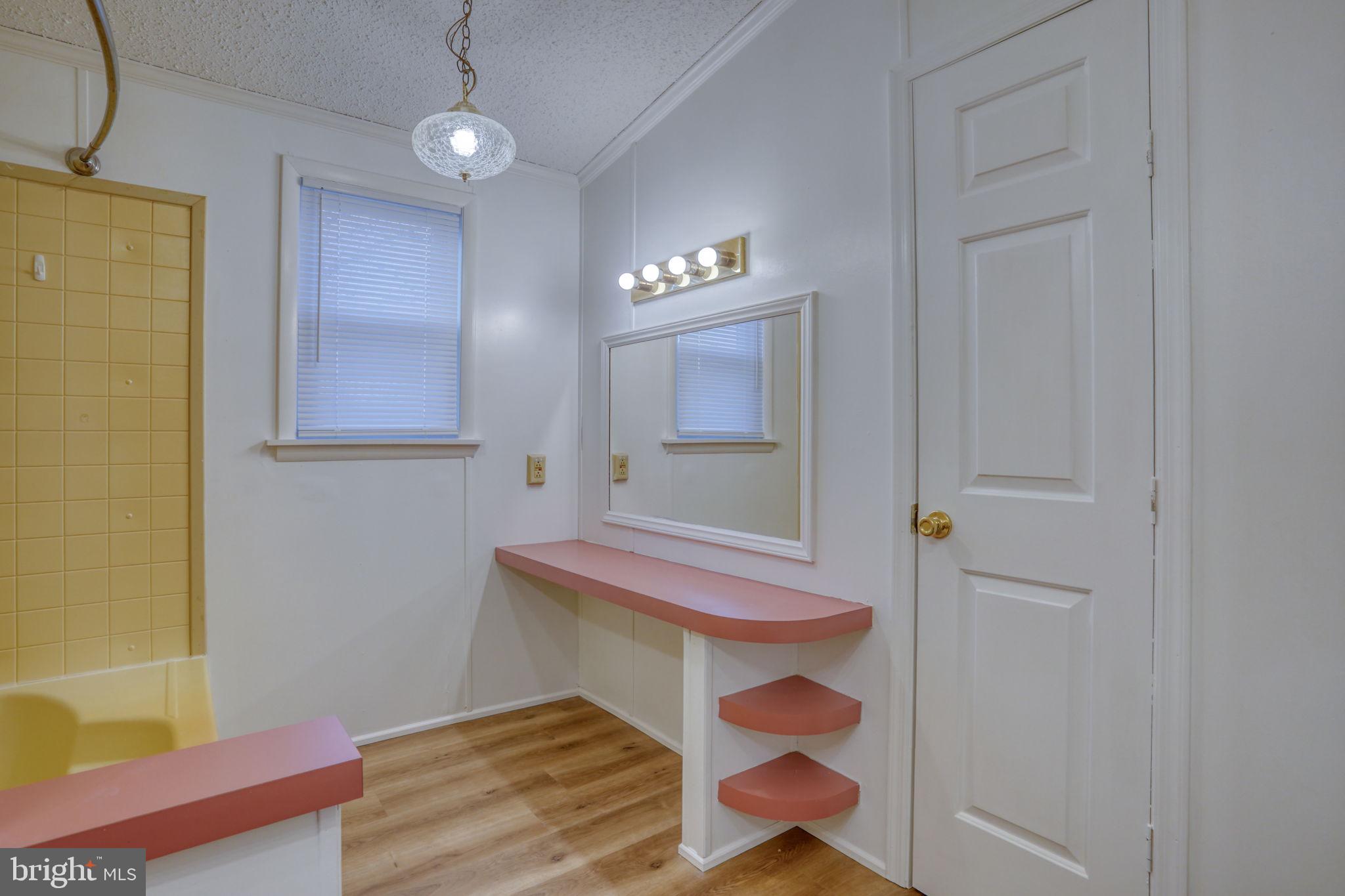 4285 Carpenter Bridge Road Felton, DE 19943 - Photo 37 of 45 a room with wooden floor and fan