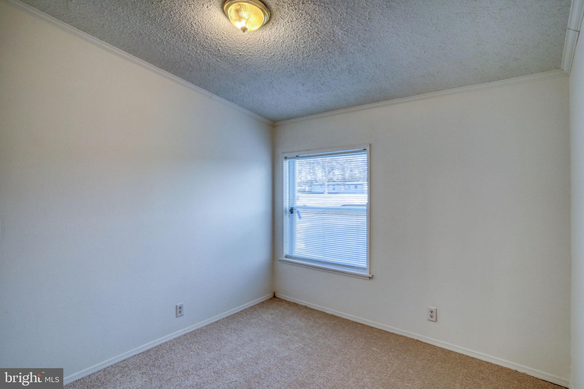 4285 Carpenter Bridge Road Felton, DE 19943 - Photo 40 of 45 an empty room with a window
