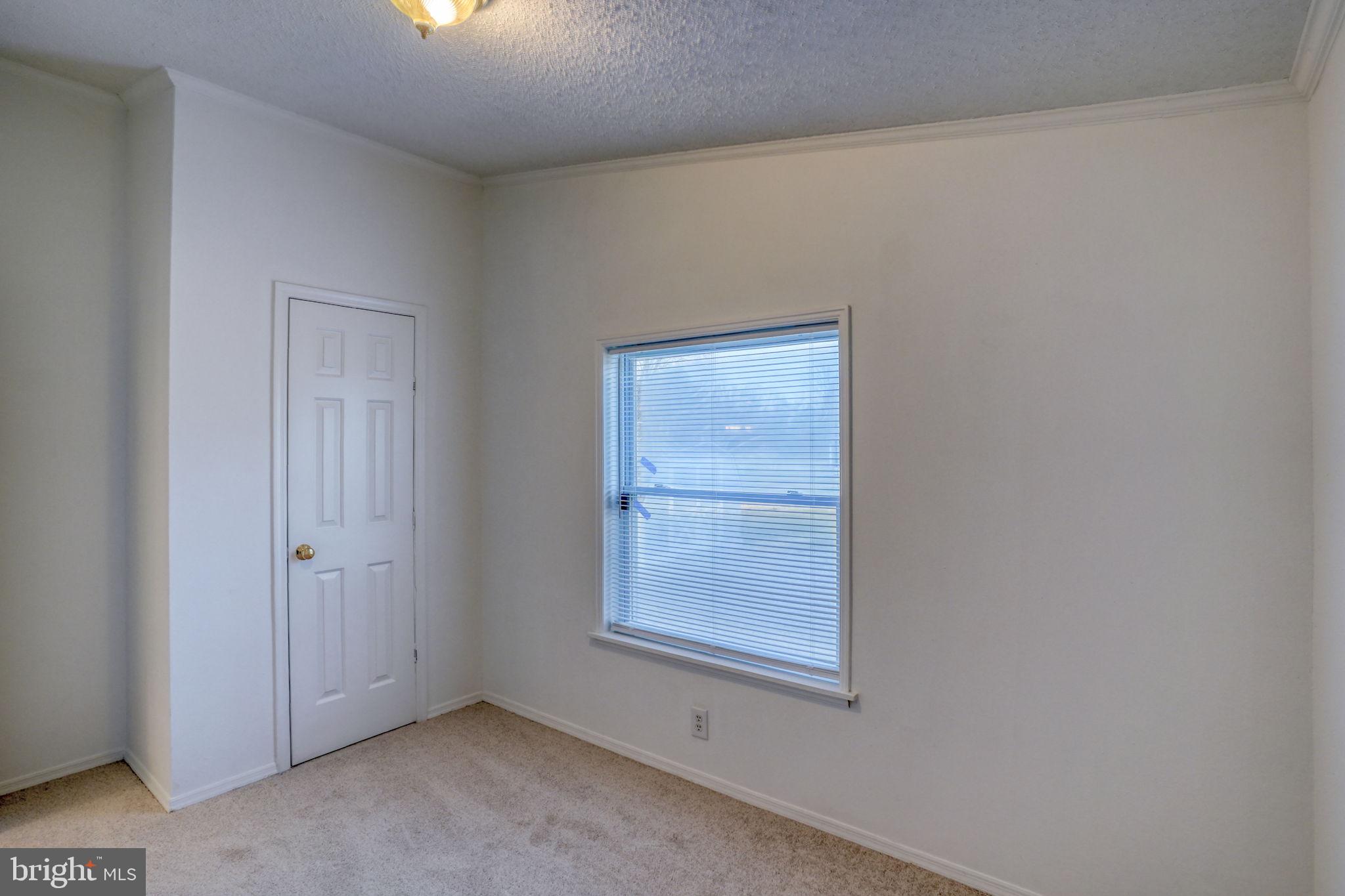4285 Carpenter Bridge Road Felton, DE 19943 - Photo 42 of 45 an empty room with windows
