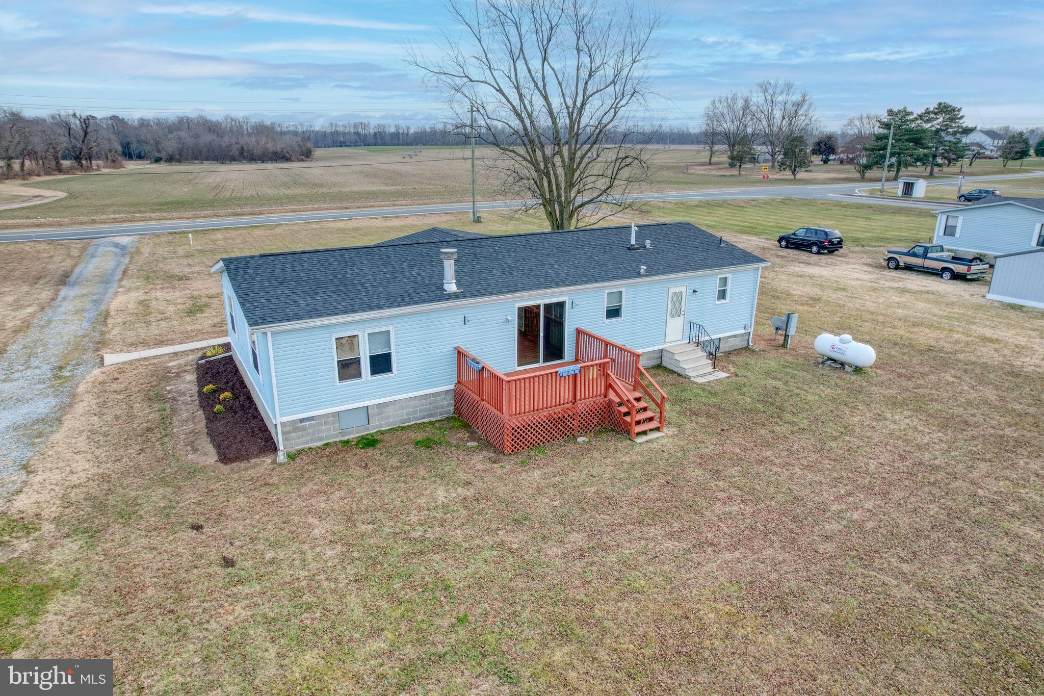 4285 Carpenter Bridge Road Felton, DE 19943 - Photo 5 of 45 a view of a house with a yard and wooden fence