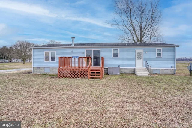 a view of a balcony with wooden floor and city view
