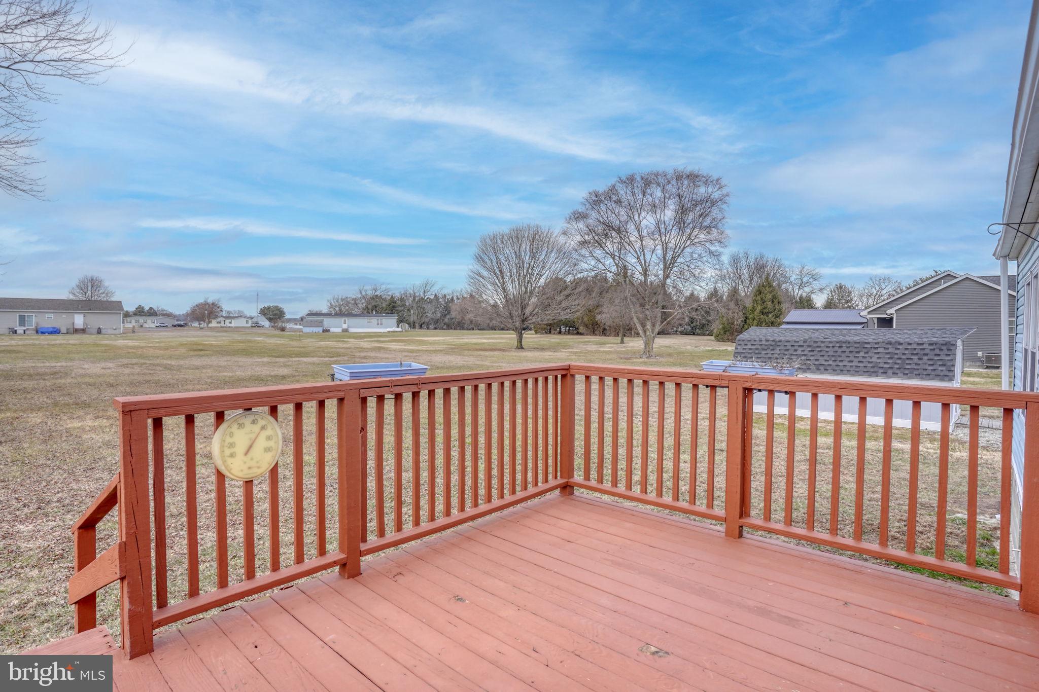 4285 Carpenter Bridge Road Felton, DE 19943 - Photo 8 of 45 a view of a balcony with wooden floor and city view