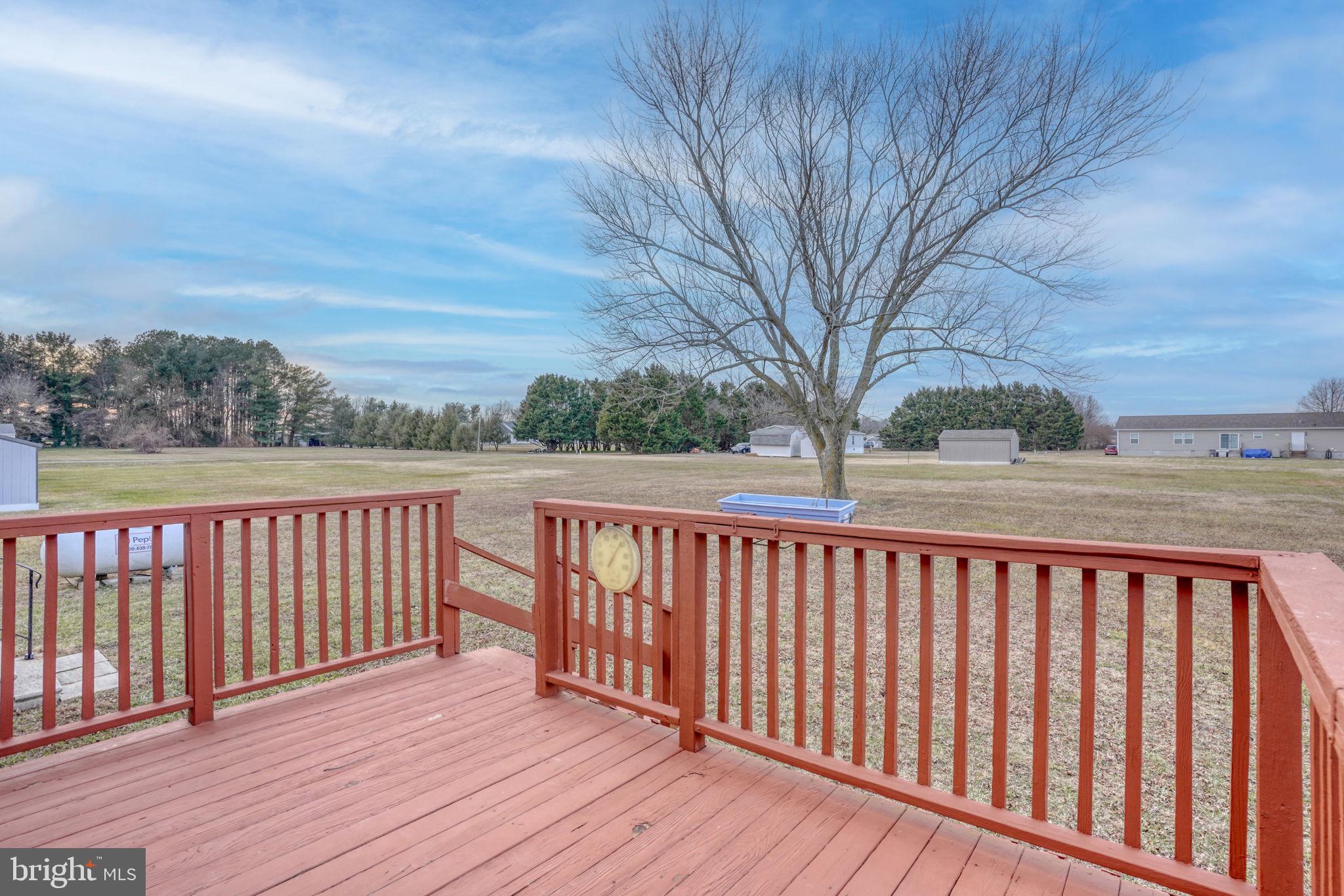 4285 Carpenter Bridge Road Felton, DE 19943 - Photo 9 of 45 a balcony with wooden floor and fence