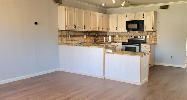 a view of a kitchen with appliances
