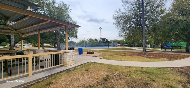 a view of a swimming pool with a patio