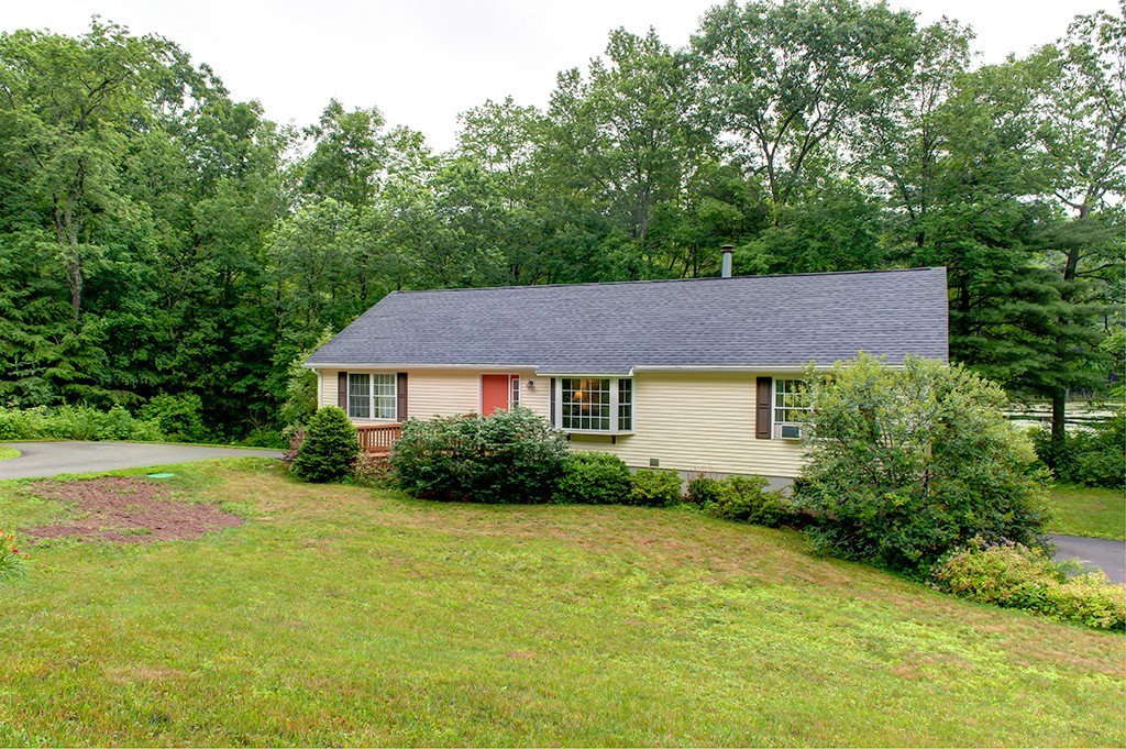 64 Farm Pond Road Oakham, MA 01068 - Photo 1 of 20 a view of a house with garden