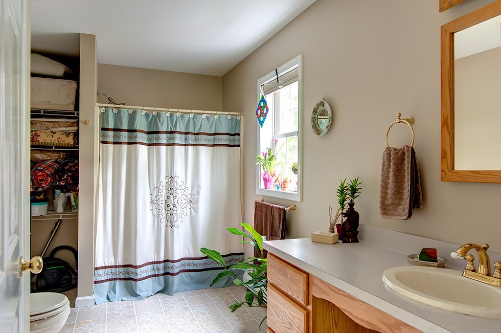 64 Farm Pond Road Oakham, MA 01068 - Photo 11 of 20 a bathroom with a sink and a mirror