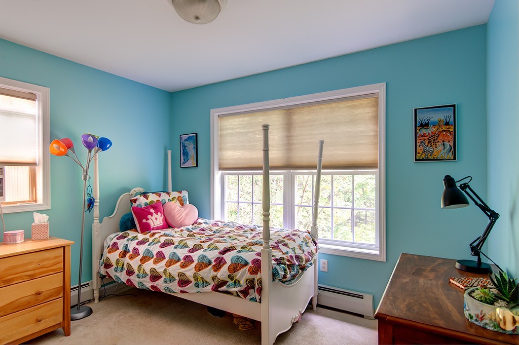 64 Farm Pond Road Oakham, MA 01068 - Photo 15 of 20 a bedroom with a bed and wooden floor