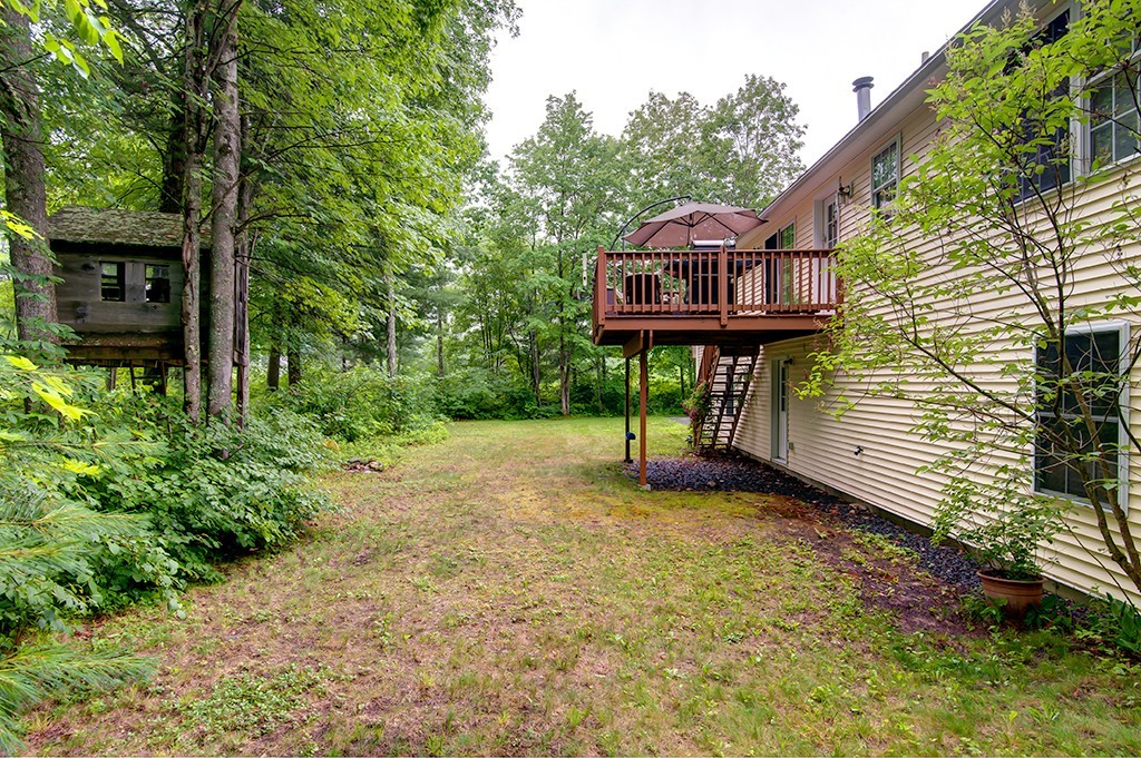 64 Farm Pond Road Oakham, MA 01068 - Photo 19 of 20 a view of a back yard with a house