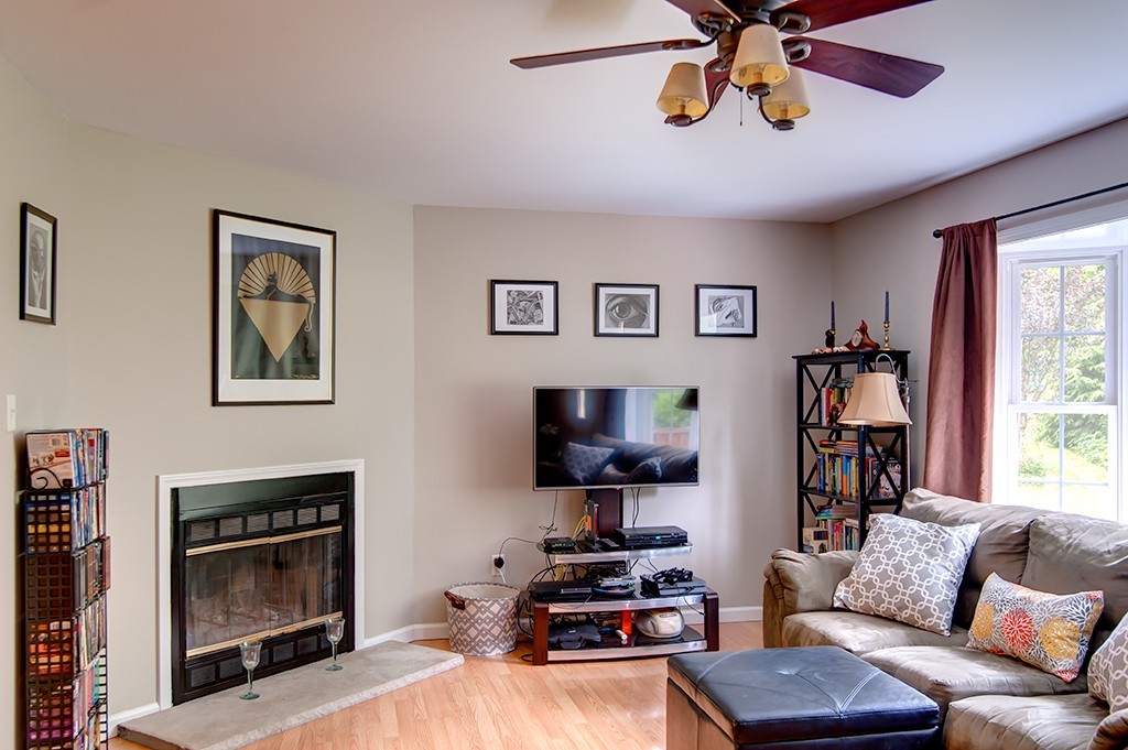 64 Farm Pond Road Oakham, MA 01068 - Photo 3 of 20 a living room with furniture and a fireplace