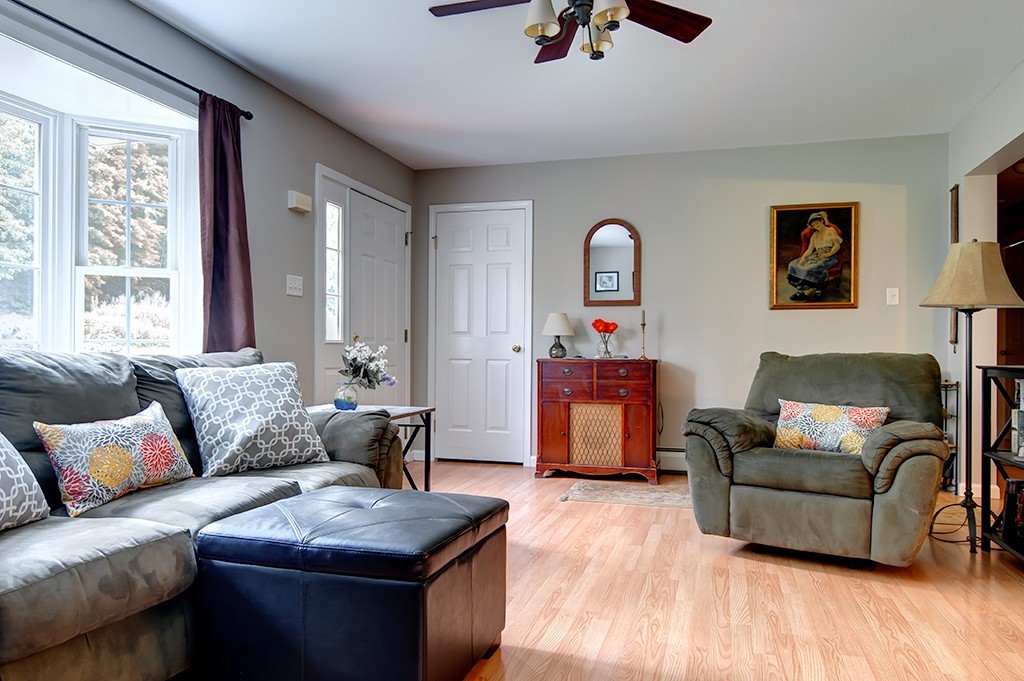 64 Farm Pond Road Oakham, MA 01068 - Photo 4 of 20 a living room with furniture and a large window