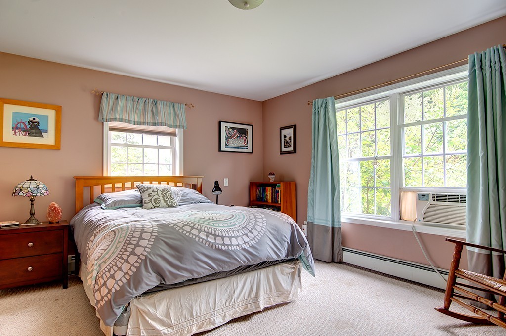 64 Farm Pond Road Oakham, MA 01068 - Photo 10 of 20 a bedroom with a bed and a window