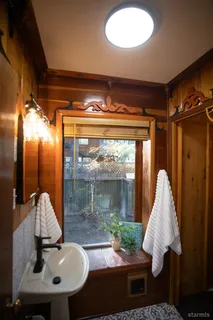 a view of a livingroom with furniture and window