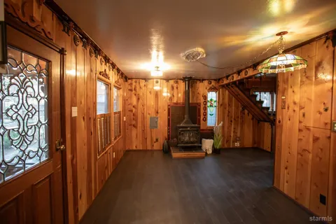 a view of a hallway with stairs
