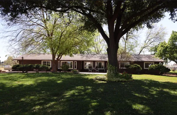 a front view of house with a yard