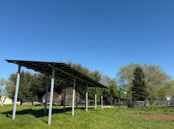 an aerial view of a house with a swimming pool