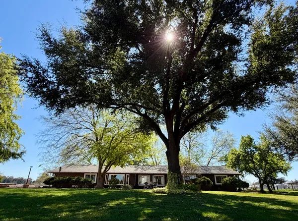 a living room with fireplace furniture and a flat screen tv