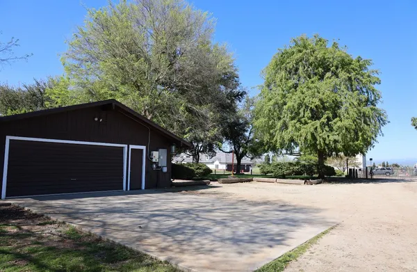 a living room with lots of furniture and a chandelier