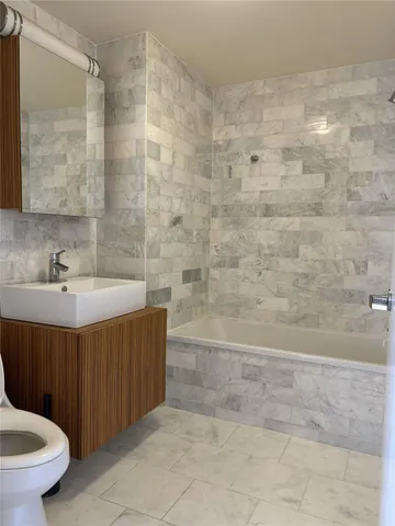 a bathroom with a sink and a shower