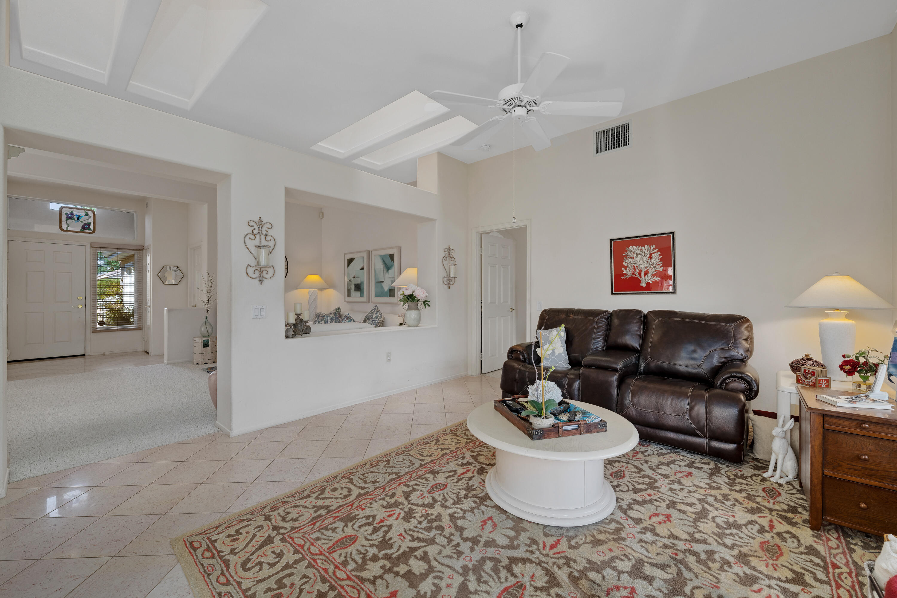 78274 Rainbow Drive Palm Desert, CA 92211 - Photo 12 of 24 a living room with furniture and a couch