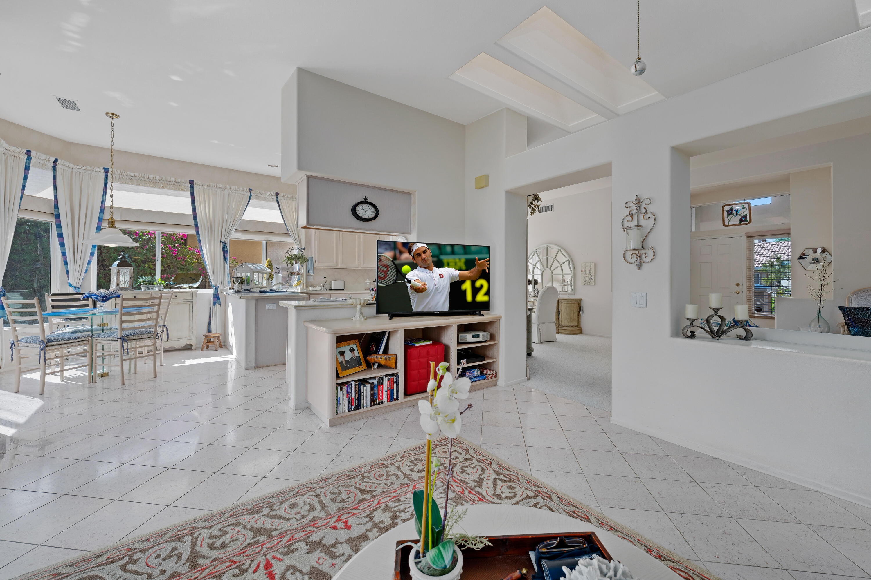78274 Rainbow Drive Palm Desert, CA 92211 - Photo 13 of 24 a living room with furniture and a flat screen tv