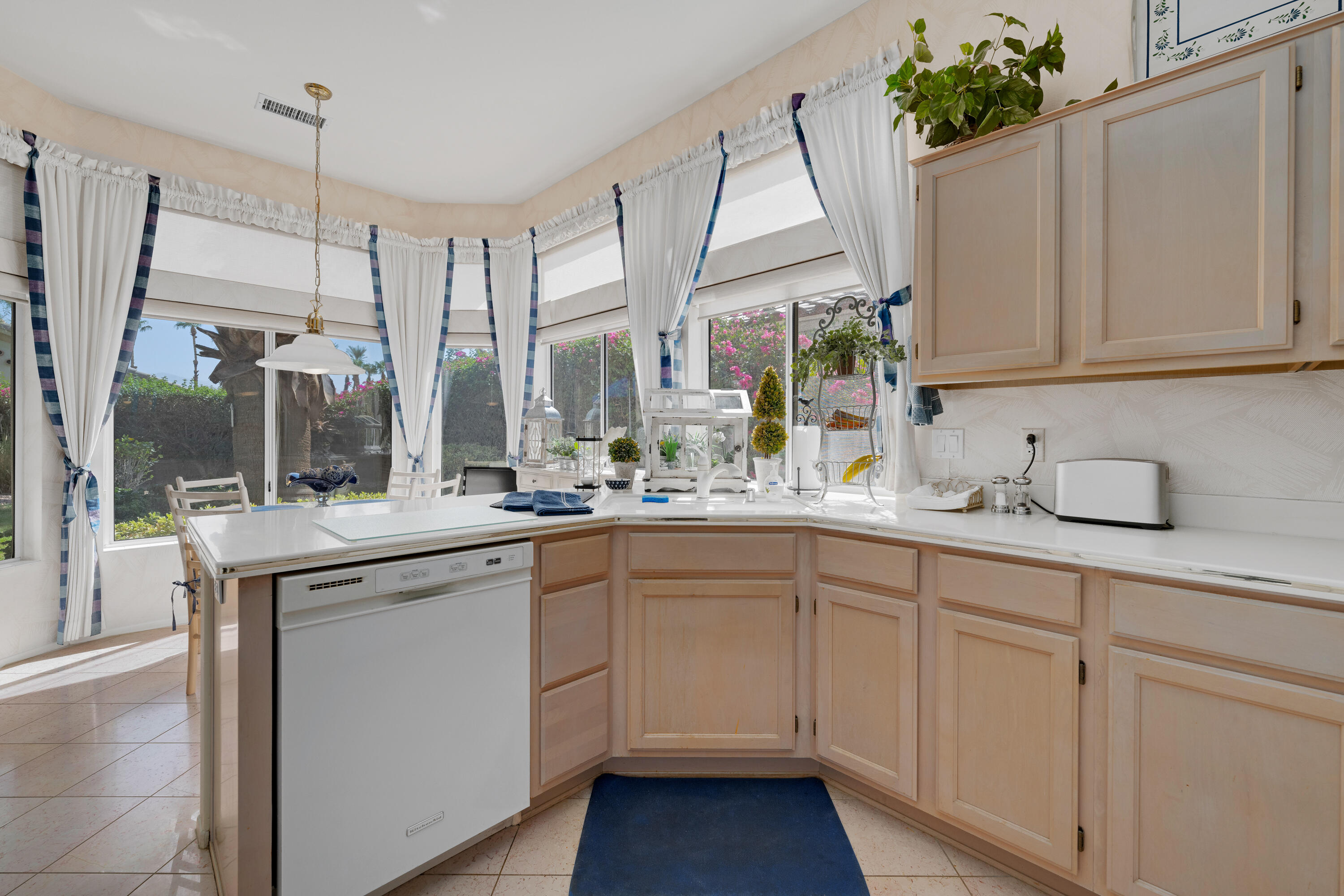 78274 Rainbow Drive Palm Desert, CA 92211 - Photo 15 of 24 a kitchen with sink and white cabinets