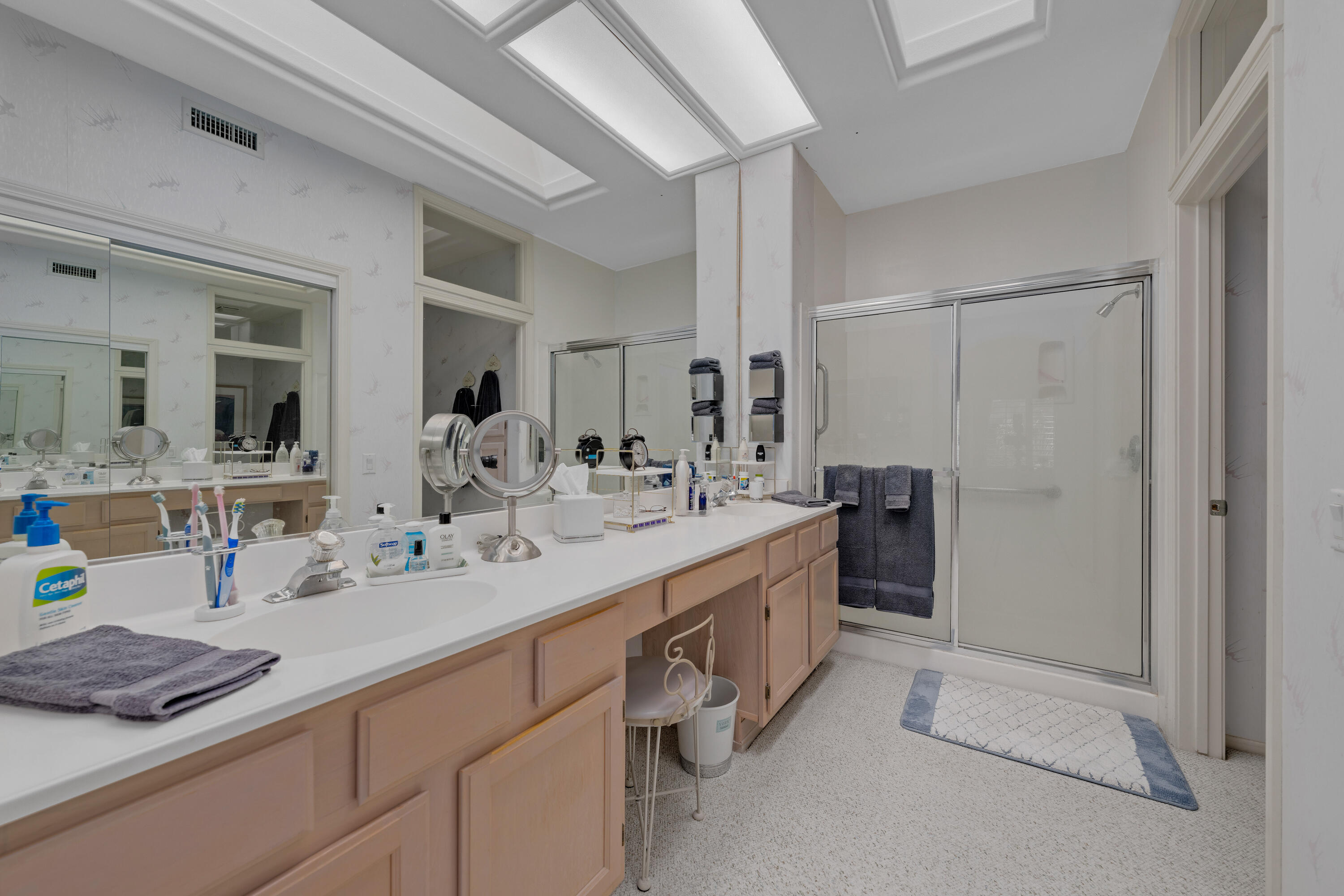 78274 Rainbow Drive Palm Desert, CA 92211 - Photo 20 of 24 a bathroom with a double vanity sink mirror and shower