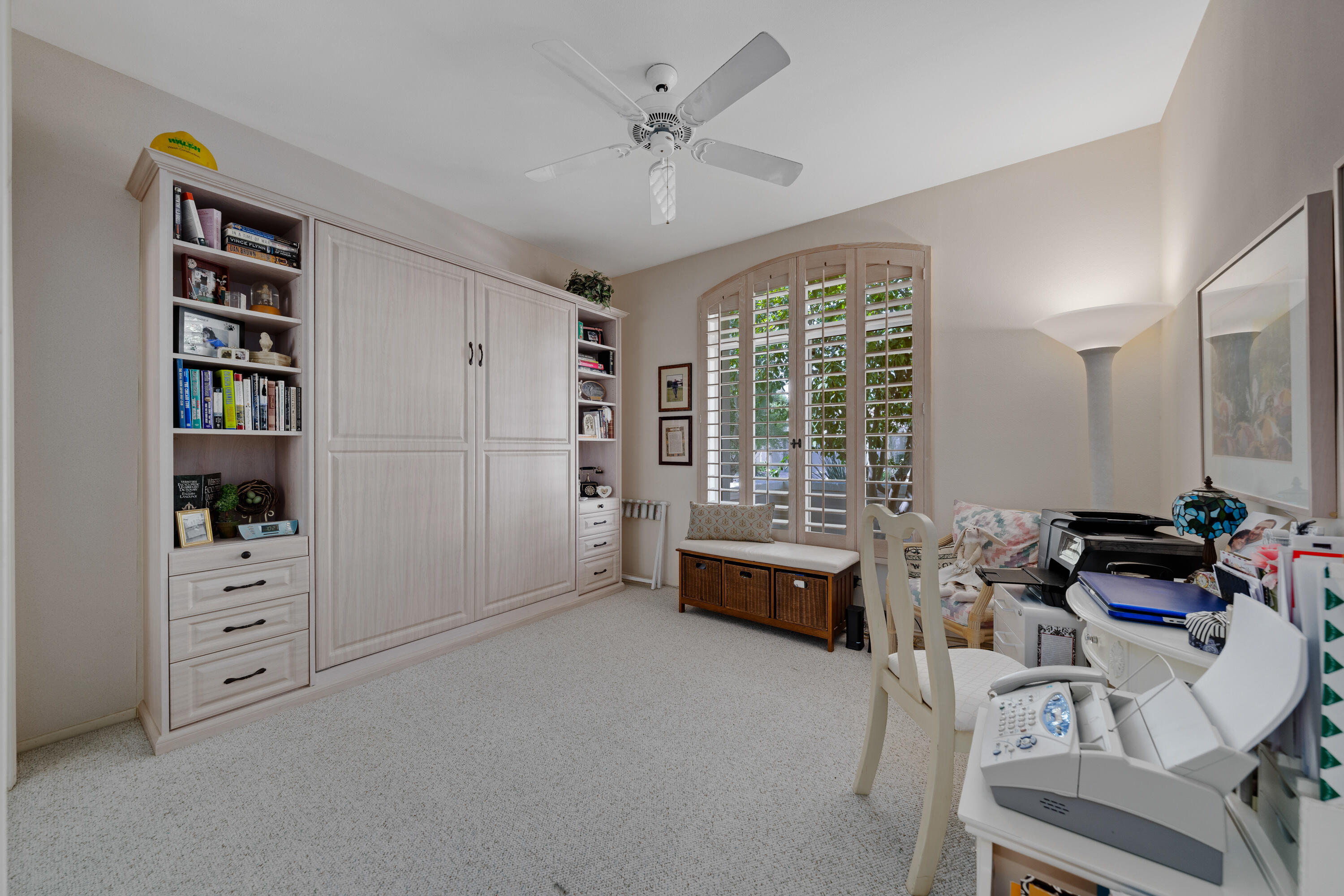 78274 Rainbow Drive Palm Desert, CA 92211 - Photo 21 of 24 a room with furniture window and book shelf