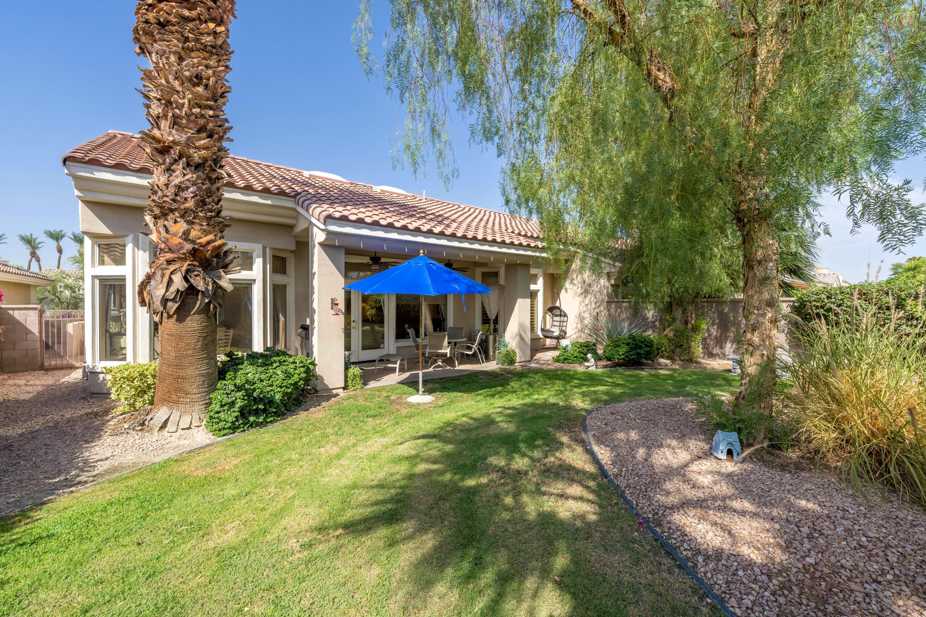 78274 Rainbow Drive Palm Desert, CA 92211 - Photo 5 of 24 a view of a house with backyard and sitting area