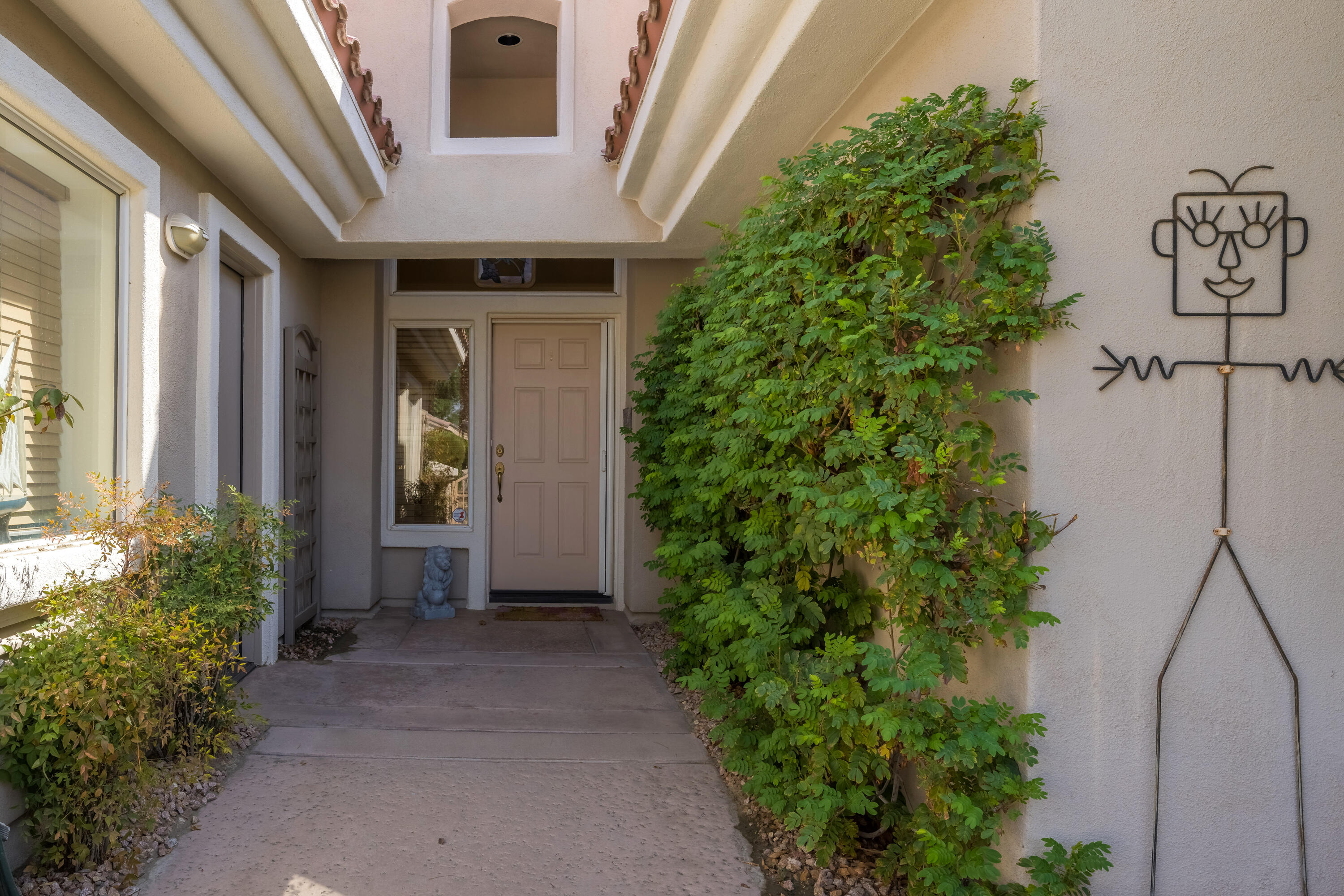 78274 Rainbow Drive Palm Desert, CA 92211 - Photo 6 of 24 a front view of a house with garden