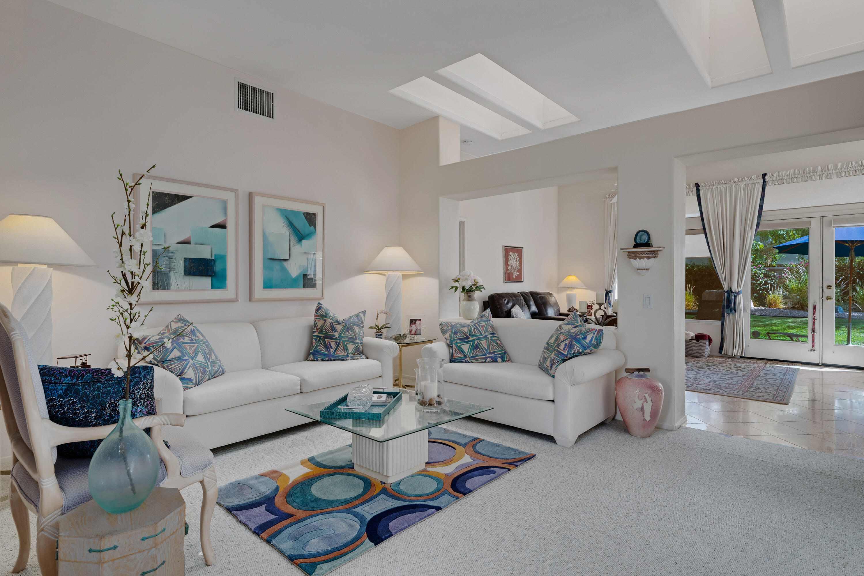 78274 Rainbow Drive Palm Desert, CA 92211 - Photo 8 of 24 a living room with furniture and a large window