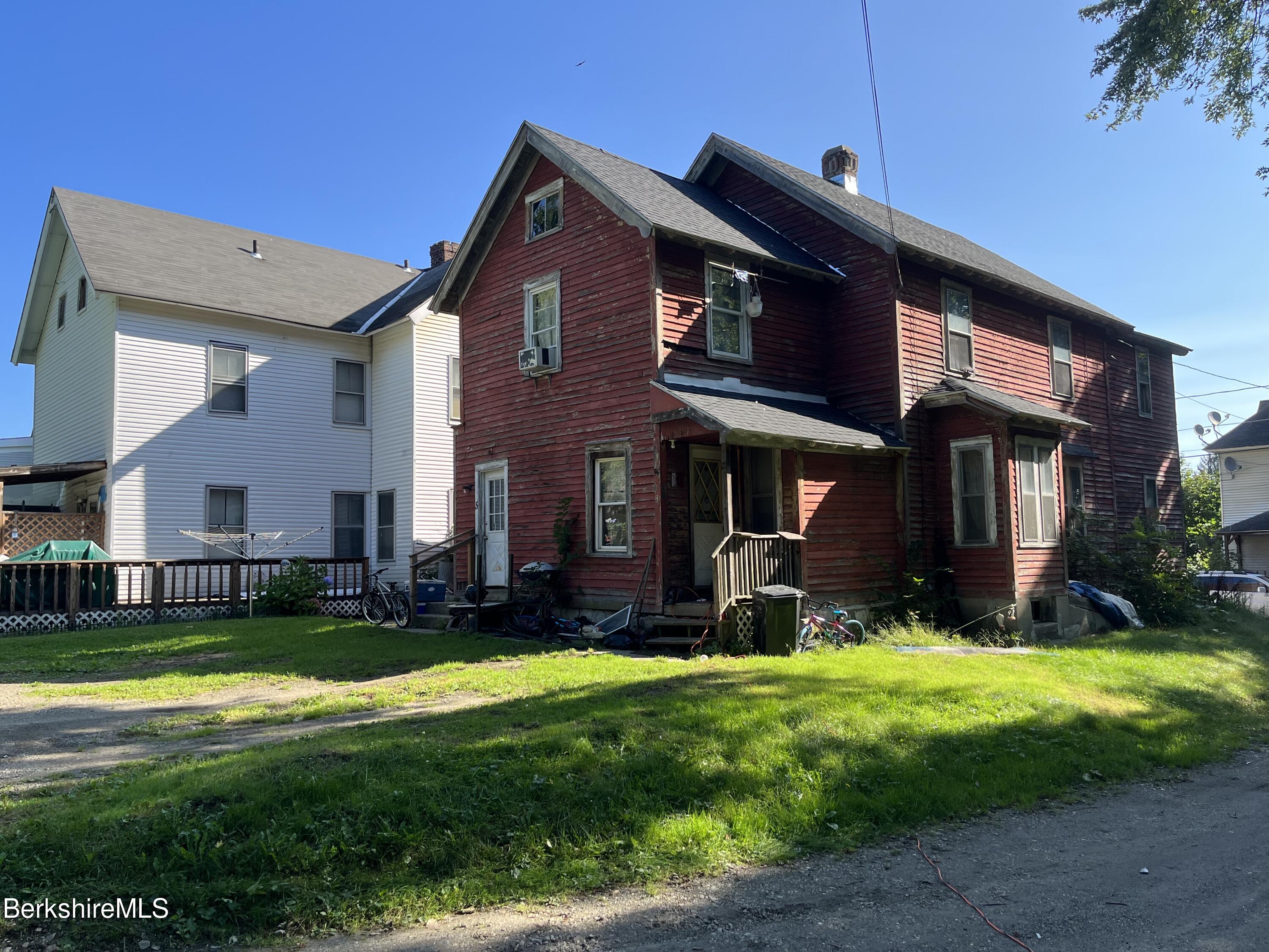 1 1/2 Cherry Street Pittsfield, MA 01201 - Photo 1 of 11 a front view of a house with a yard