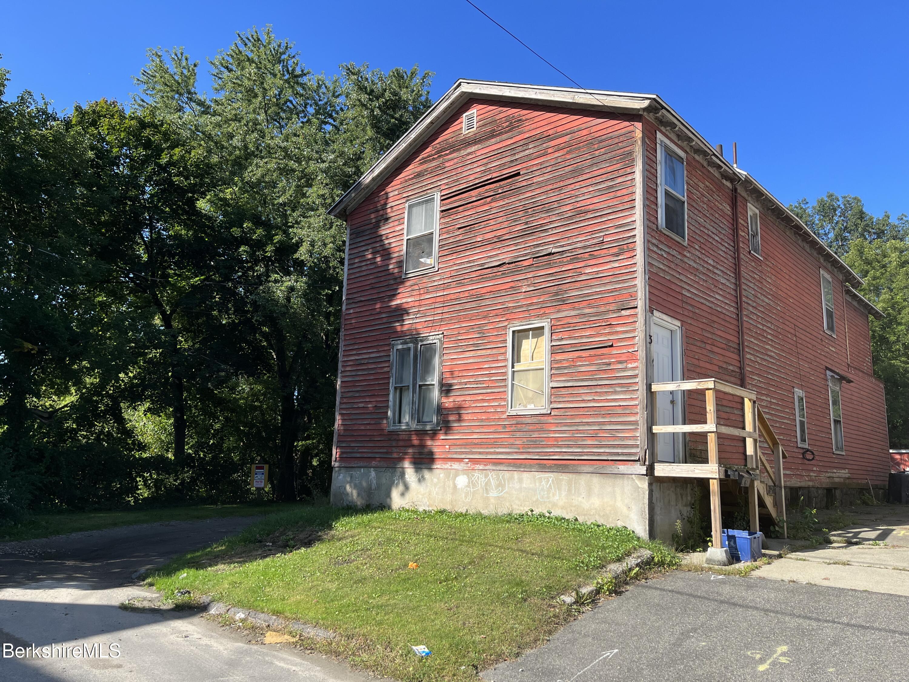 1 1/2 Cherry Street Pittsfield, MA 01201 - Photo 3 of 11 a front view of a house with a yard
