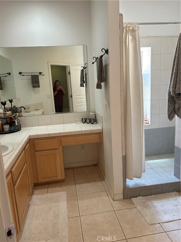 77517 Lowes Canyon Road San Miguel, CA 93451 - Photo 11 of 20 a bathroom with a sink a toilet and a mirror