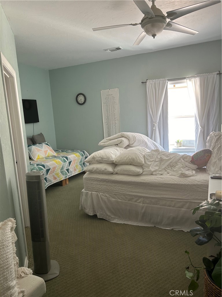 77517 Lowes Canyon Road San Miguel, CA 93451 - Photo 14 of 20 a bedroom with a bed and a window