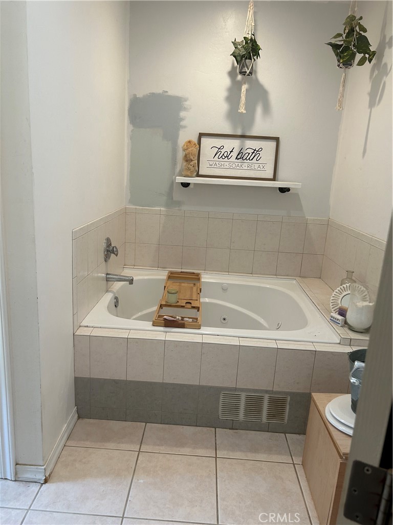 77517 Lowes Canyon Road San Miguel, CA 93451 - Photo 17 of 20 a bathroom with a bathtub and a shower