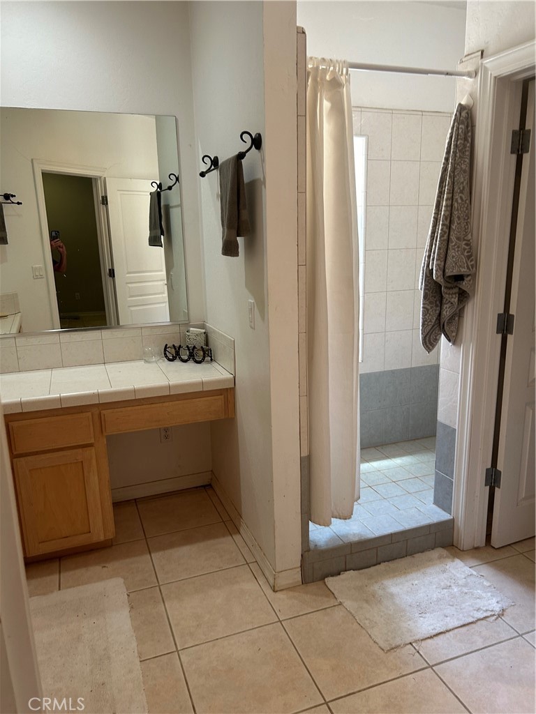 77517 Lowes Canyon Road San Miguel, CA 93451 - Photo 20 of 20 a bathroom with a sink a toilet a mirror and shower