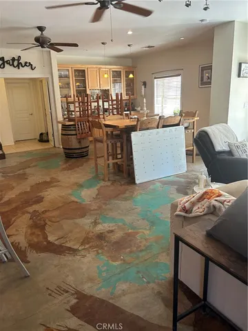 a kitchen with kitchen island granite countertop wooden cabinets and center island