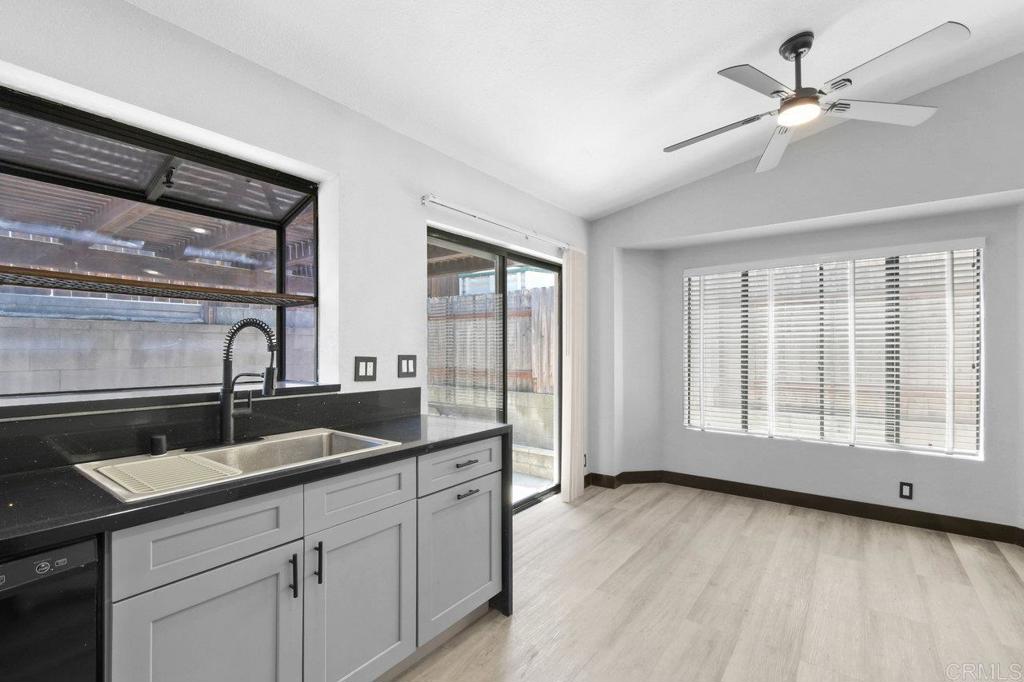 8409 Sleepy Way El Cajon, CA 92021 - Photo 11 of 31 a kitchen with granite countertop a sink and cabinets