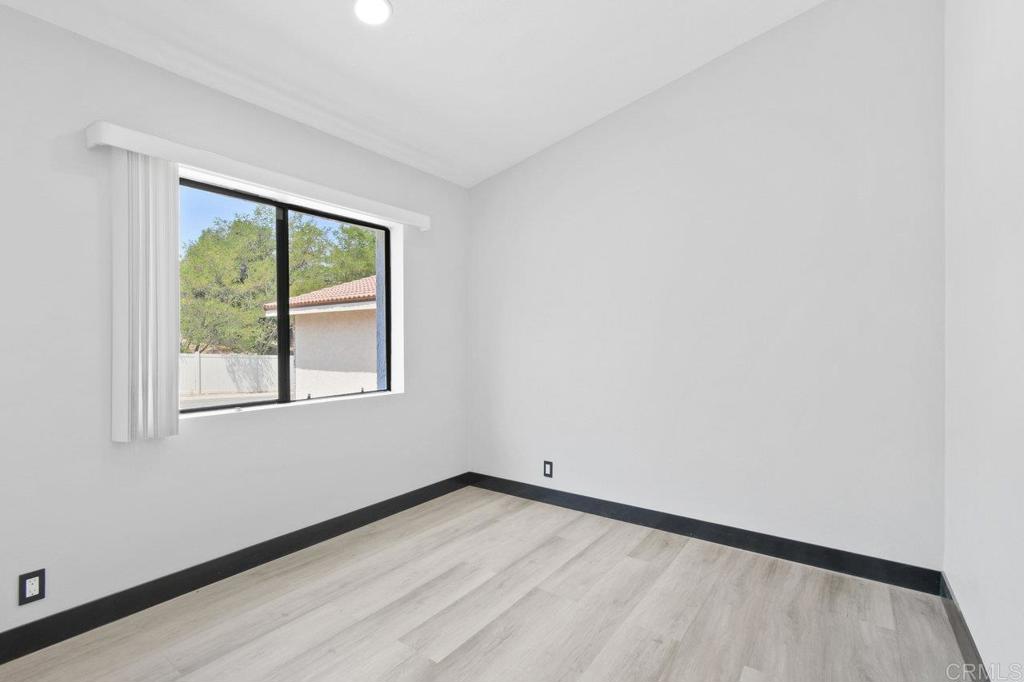 8409 Sleepy Way El Cajon, CA 92021 - Photo 18 of 31 an empty room with a window