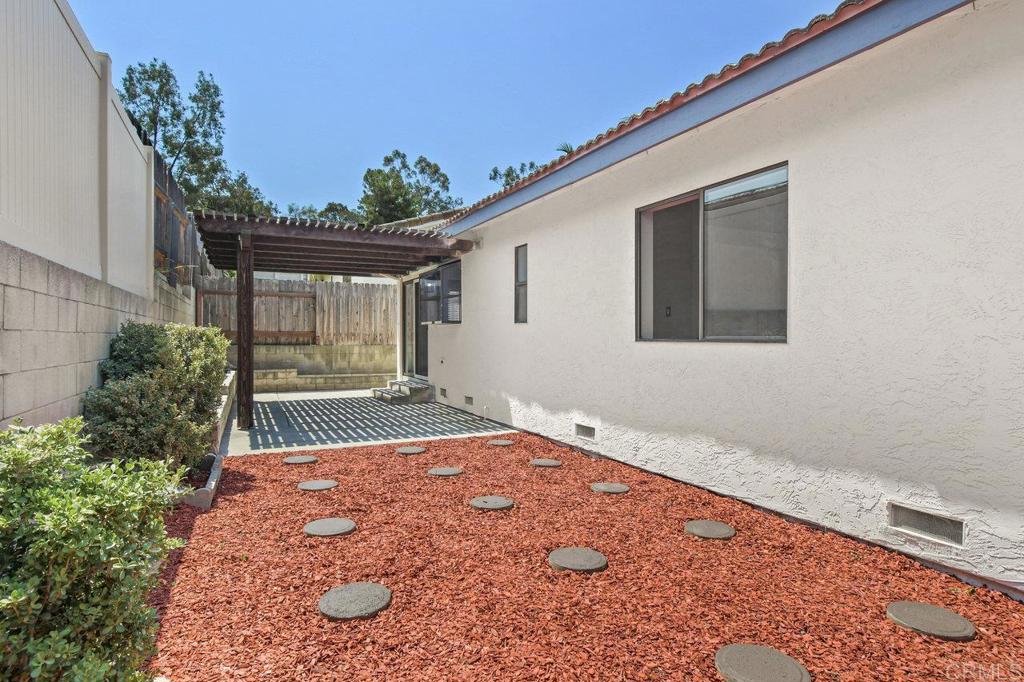 8409 Sleepy Way El Cajon, CA 92021 - Photo 25 of 31 a view of a backyard with a garden