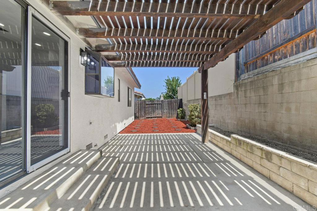 8409 Sleepy Way El Cajon, CA 92021 - Photo 28 of 31 a view of a balcony with wooden floor