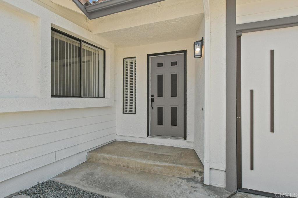 8409 Sleepy Way El Cajon, CA 92021 - Photo 4 of 31 a view of a entryway door of the house